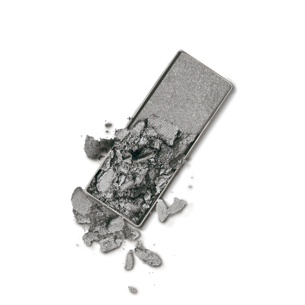 Gray matte eyeshadow pan with crushed powder next to intact section, Soft Touch Shadow, soft neutral tones for stylish kids clothing and mom life essentials.