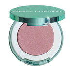 Merle Norman eyeshadow compact with a sparkling pinkish-rose shadow and a metallic mint green lid, shown open on a white background.