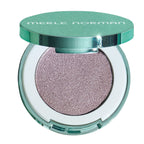 Merle Norman eyeshadow compact with a shimmering lavender-pink pressed powder and a metallic teal-green lid, shown open on a white background.