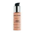 Bottle of Merle Norman Cosmetics - Timeless Illuminating Makeup Broad Spectrum SPF 30 in a light alabaster shade with a black pump and silver collar against a white background.