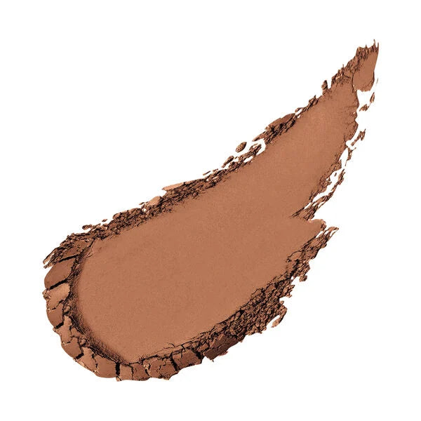 Smooth swatch of medium tan pressed powder makeup showcasing Merle Norman Cosmetics - Ultra Powder Foundation for a natural, flawless finish.